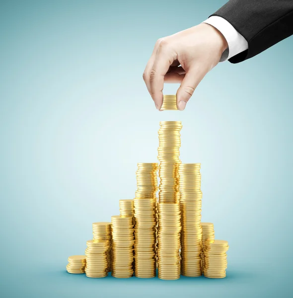 stacking gold coins 